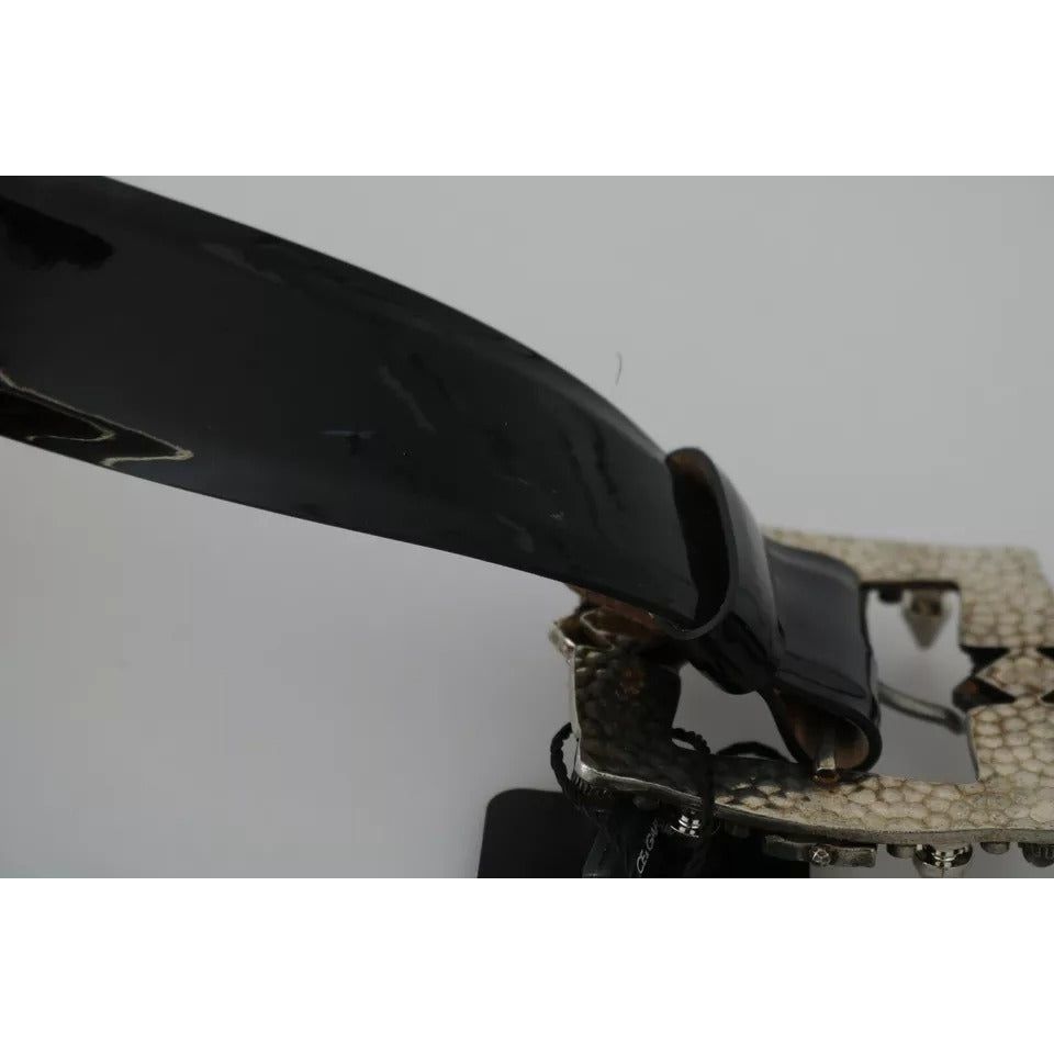 حزام دولتشي آند غابانا المصنوع من الجلد الأسود اللامع والمزين بشعار الكريستال