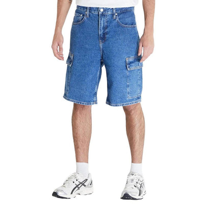 Calvin Klein Jeans Blue Cotton Bermuda Shorts in 90's loose fit with flap side pockets, ideal for casual and contemporary summer style.