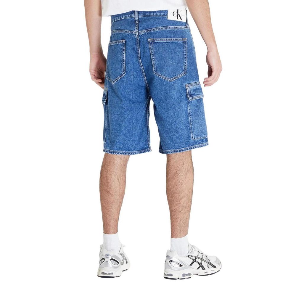Calvin Klein Jeans Blue Cotton Bermuda Shorts with flap pockets, back view showcasing relaxed 90's loose fit for men.