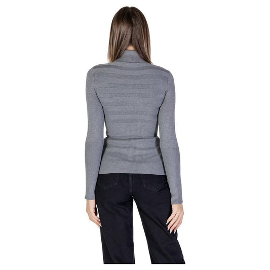 Back view of a woman wearing a Morgan De Toi gray viscose sweater, part of the women's knitwear fall/winter collection.