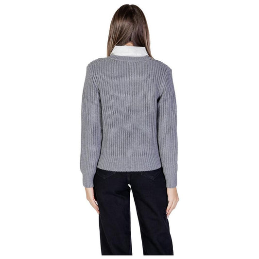 Back view of a woman wearing a gray Morgan De Toi viscose sweater, part of the fall/winter women's knitwear collection.