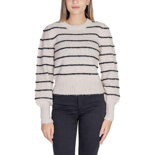 Woman wearing Jacqueline De Yong gray striped polyester sweater, ideal for autumn/winter fashion.