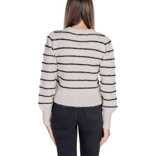 Back view of woman wearing Jacqueline De Yong gray polyester sweater with black stripes, part of autumn/winter collection.