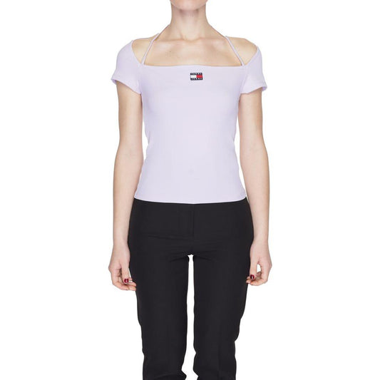 Woman wearing Tommy Hilfiger purple recycled polyester T-shirt, spring/summer collection, with logo and off-shoulder design.