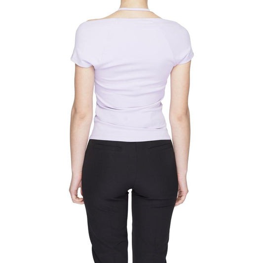 Back view of a woman wearing a purple Tommy Hilfiger recycled polyester T-shirt, showcasing its fit and style for spring/summer.