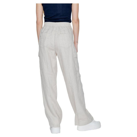 Back view of beige linen bootcut pants for women, part of Street One's Spring/Summer collection, made from 100% linen, worn with sneakers.
