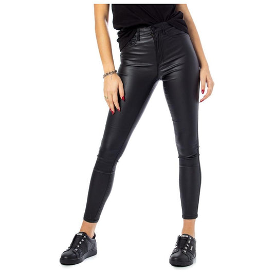 Woman wearing Only black viscose skinny jeans with high-waist and rock coated finish, showcasing a sleek and stylish look.