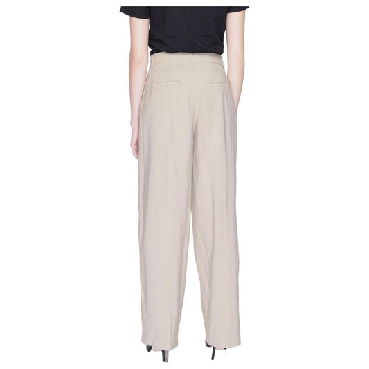 Back view of women's beige palazzo trousers, spring/summer collection, made from 93% Viscose LENZING™ ECOVERO™, 7% Polyester.