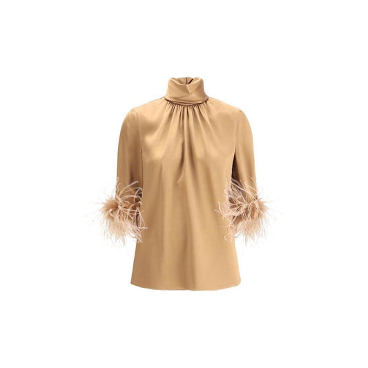 Dolce & Gabbana tan blouse with high neck, 3/4 sleeves, and feather trim, showcasing elegance and luxury. Back zipper adds a perfect fit.