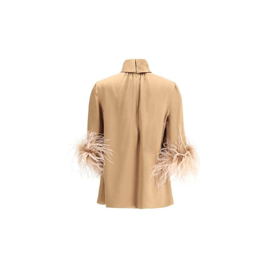 Dolce & Gabbana feathers blouse with high neck and 3/4 sleeves featuring feather trim. Back view showcasing elegant design and zipper closure.