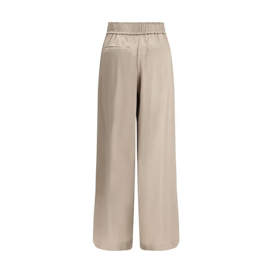 Brunello Cucinelli silk palazzo pants with elastic waistband and back welt pockets, beige color, elegant and comfortable design.