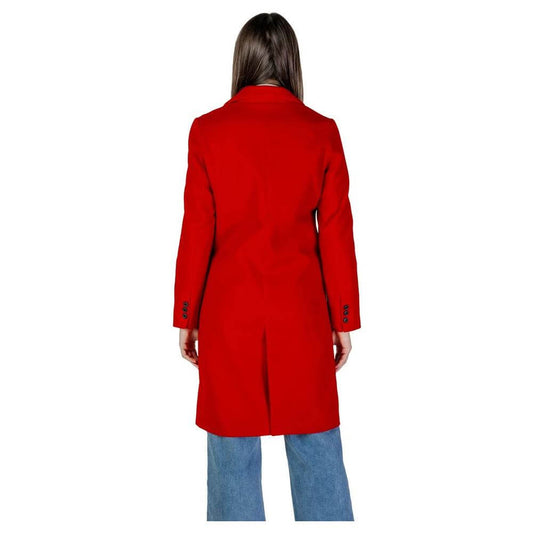 Back view of a woman wearing a Vero Moda red polyester and recycled polyester coat, ideal for fall and winter fashion.