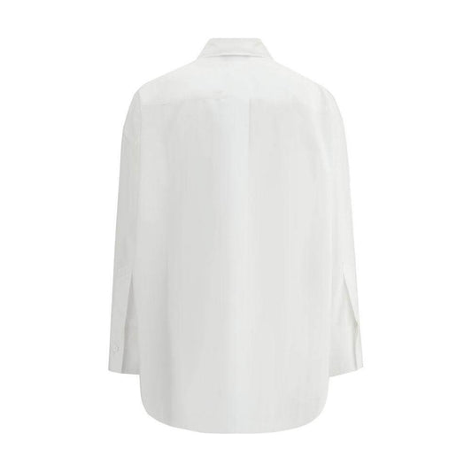 Back view of The Attico oversized cotton shirt with wide sleeves, featuring asymmetrical front slit and tone-on-tone logo.