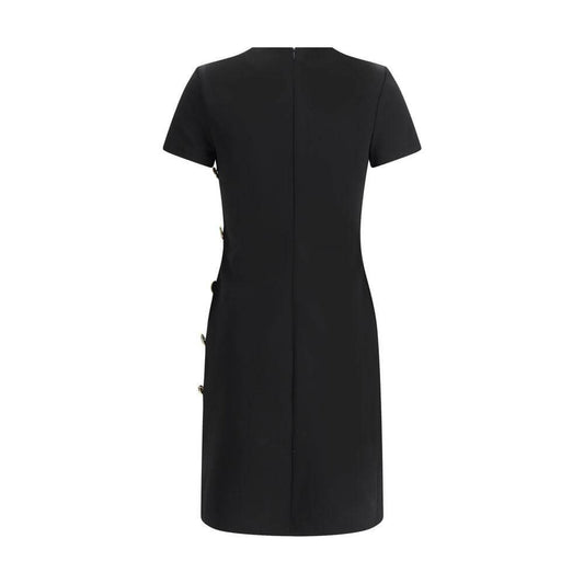 Back view of Givenchy short-sleeved dress with zipper closure and side button detail, showcasing sleek monochrome design and regular fit.