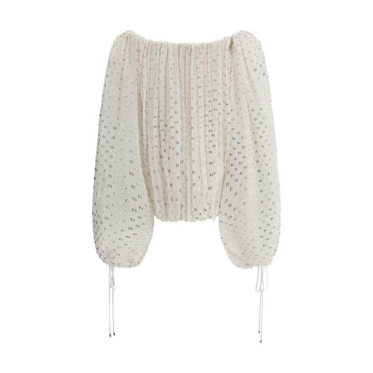 Chloé off-shoulder shirt with balloon sleeves and shimmering polka dot embroidery for an elegant summer look.