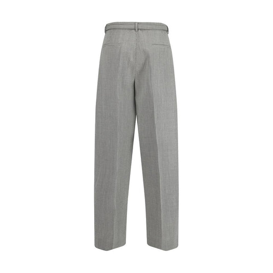 Back view of Jil Sander virgin wool wide-leg pants with belt loops and welt pockets, showcasing sleek, contemporary design.