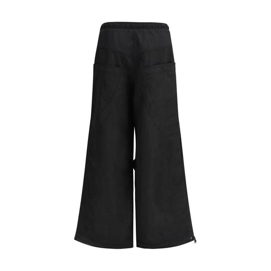 The Attico Nylon cargo pants with drawstring elastic waistband and multiple pockets, wide-leg urban style.
