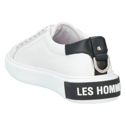 Les Hommes white calfskin men's sneaker with black leather heel, silver logo, and decorative metal ring detail.