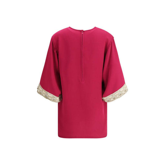 Back view of Valentino's Jewel Top featuring flared sleeves with pearl and bead embroidery, elegant crew neck, and zipper closure.