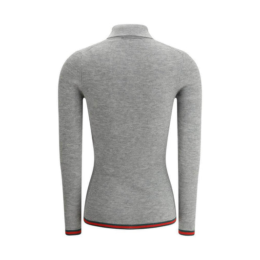 Back view of Gucci Cashmere Polo Shirt featuring ribbed design, classic collar, and iconic colored bands on hem and cuffs.