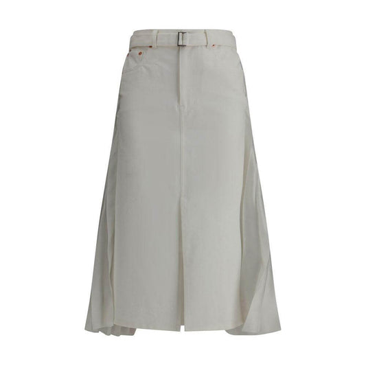 Sacai denim plissè midi skirt with five-pocket design, pleated detail, and adjustable belt, offering a blend of classic and modern styles.
