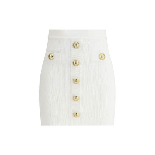Balmain mini skirt with ribbed design, gold lion's head buttons, faux welt pockets, perforated details, and contrasting zipper closure.