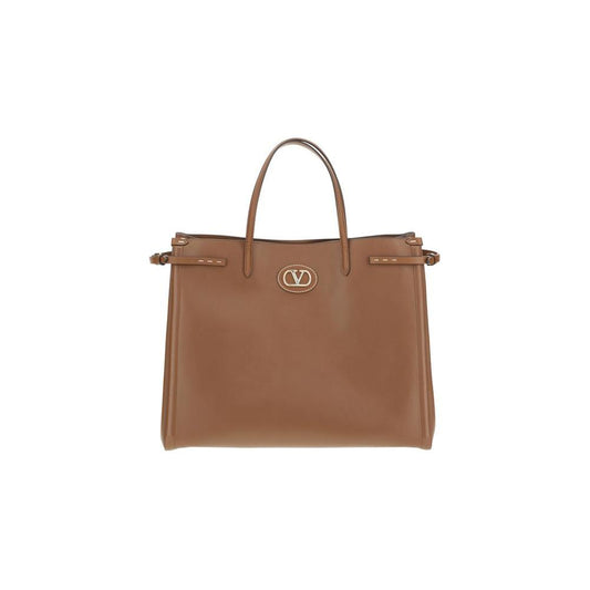Valentino Garavani Large Antibes Tote Bag in brown leather with VLogo, gold accents, and double handles.
