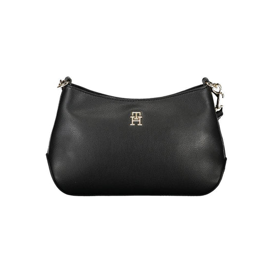 Tommy Hilfiger black polyester handbag with adjustable strap, internal pocket, zip closure, and logo on the front.
