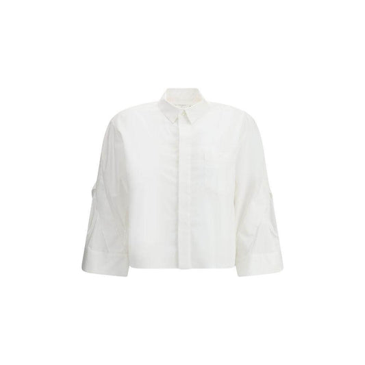 Sacai three-quarter sleeve cotton shirt with wide cuffs and classic collar, featuring a front button closure and welt breast pocket.