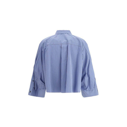 Back view of Sacai three-quarter sleeve cotton shirt with wide cuffs and classic collar, showcasing contemporary design.