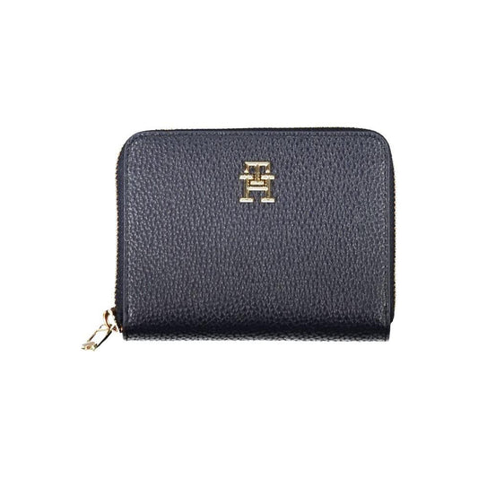 Tommy Hilfiger blue women's wallet with zip closure and gold logo, featuring five compartments and multiple card slots.