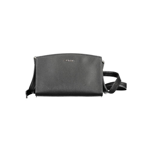 Calvin Klein black polyester women's handbag with adjustable strap and zip closure, featuring a bold logo. Chic and eco-friendly design.