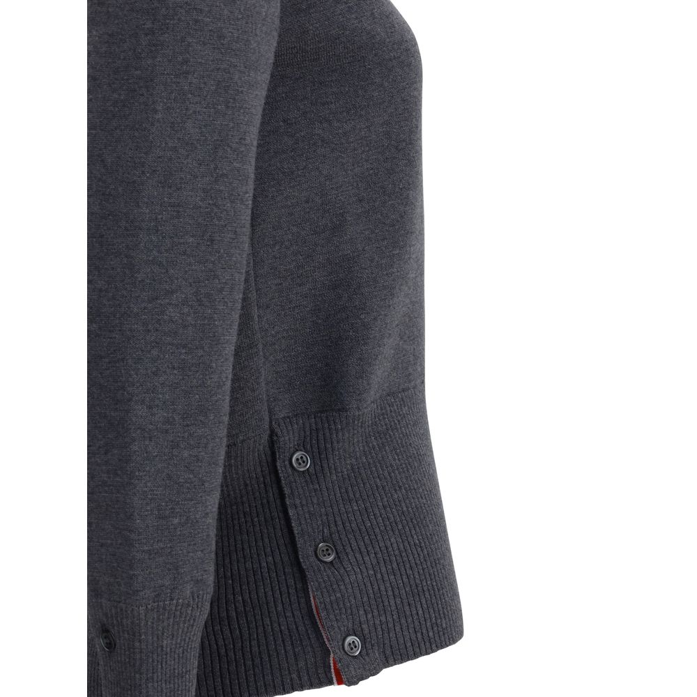 Close-up view of the Thom Browne Virgin wool Sweater's ribbed cuffs and side buttons in a dark gray color.
