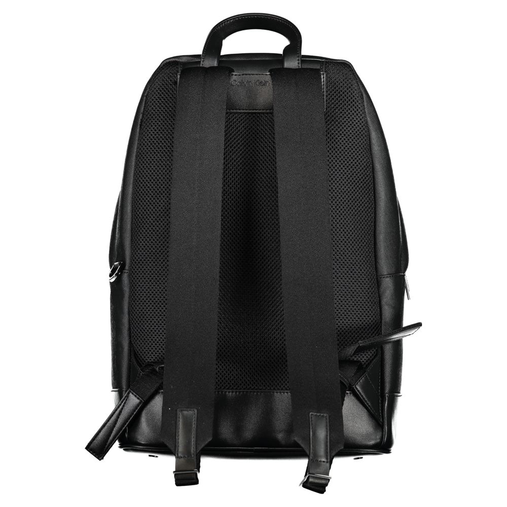 Back view of Calvin Klein Black Polyester Backpack with adjustable straps, handle, and protective feet.