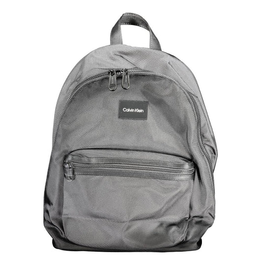 Calvin Klein Black Polyester Backpack with handle, adjustable straps, external and internal pockets, laptop compartment, eco-friendly material.