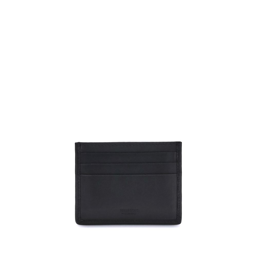 Ferragamo Black Calf Leather Bos Taurus Wallet with Gancini ornament, showcasing elegant craftsmanship and timeless design.