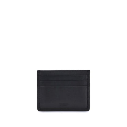 Ferragamo Black Calf Leather Bos Taurus Wallet with Gancini ornament, showcasing elegant craftsmanship and timeless design.