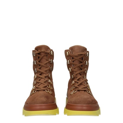 Stuart Weitzman Brown Leather Ankle Boots with sporty glam style, lace-up closure, and mid heels.