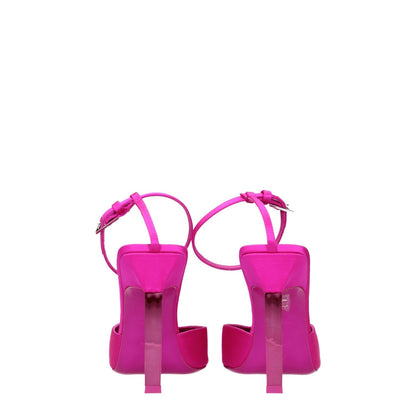 The Attico Pink Satin Stiletto Heel Sandals with buckle closure and high heel, viewed from the back, showing pointy toe design.