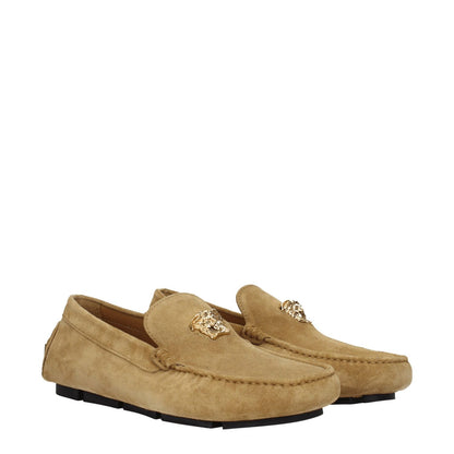 Versace Beige Leather Slip-On Loafers with gold logo, casual suede design, round toe, low flat heel, and leather sole.