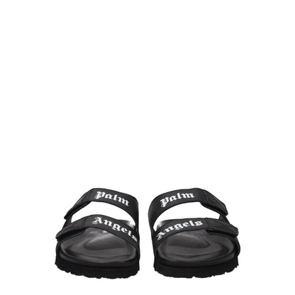 Palm Angels Black Leather Slippers with front logo and strap closure, open toe design, rubber sole, low heel, casual style footwear.