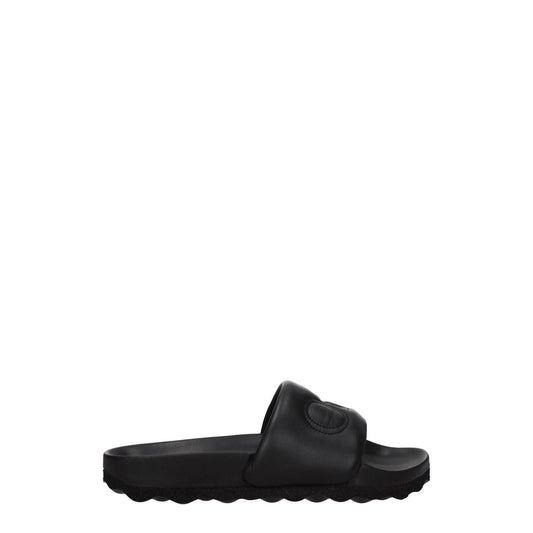 Off-White Black Leather Slippers with logo, open toe, rubber sole, and low flat heel. Casual style footwear.