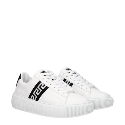 Versace White Leather Low Top Sneakers with logo, lace-up closure, black accents, rubber sole, and round toe design.
