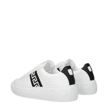 Versace White Leather Low Top Sneakers with black accents and logo design, featuring lace-up closure and rubber sole for casual style.