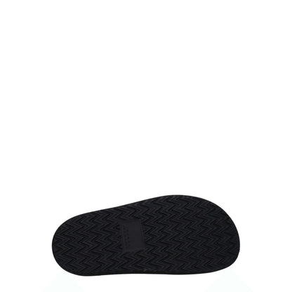 Isabel Marant Black Leather Slippers sole view, rubber sole, vintage style clogs with buckle closure and gold stud details.