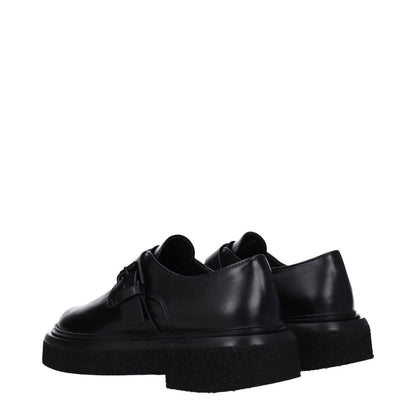 Max Mara Black Leather Oxfords And Derbies with buckle closure and rubber sole, showcasing casual style and low flat heel.