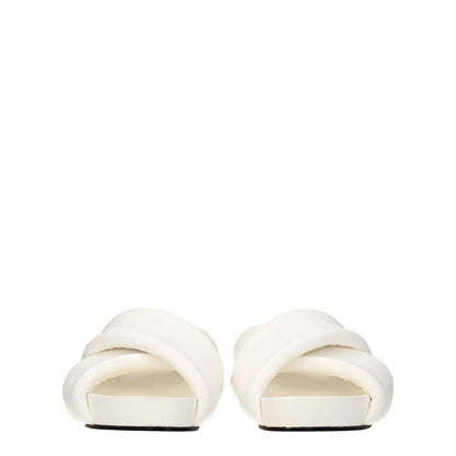 Front view of Jil Sander White Leather Slippers featuring open toe and mid heels with vintage effect.