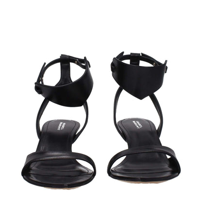 Isabel Marant Black Leather Sandals with buckle closure and mid heels, featuring a 6 cm height and open toe design.