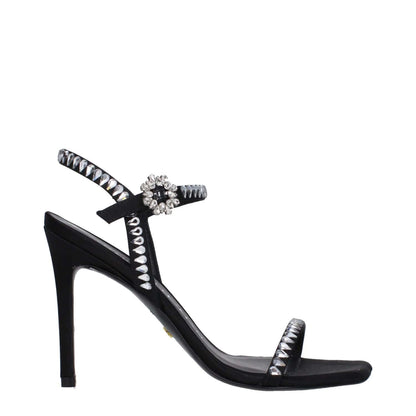 Stuart Weitzman Black Satin Stiletto Heel Sandals with rhinestone details and buckle closure, featuring a 10 cm high heel and open toe design.