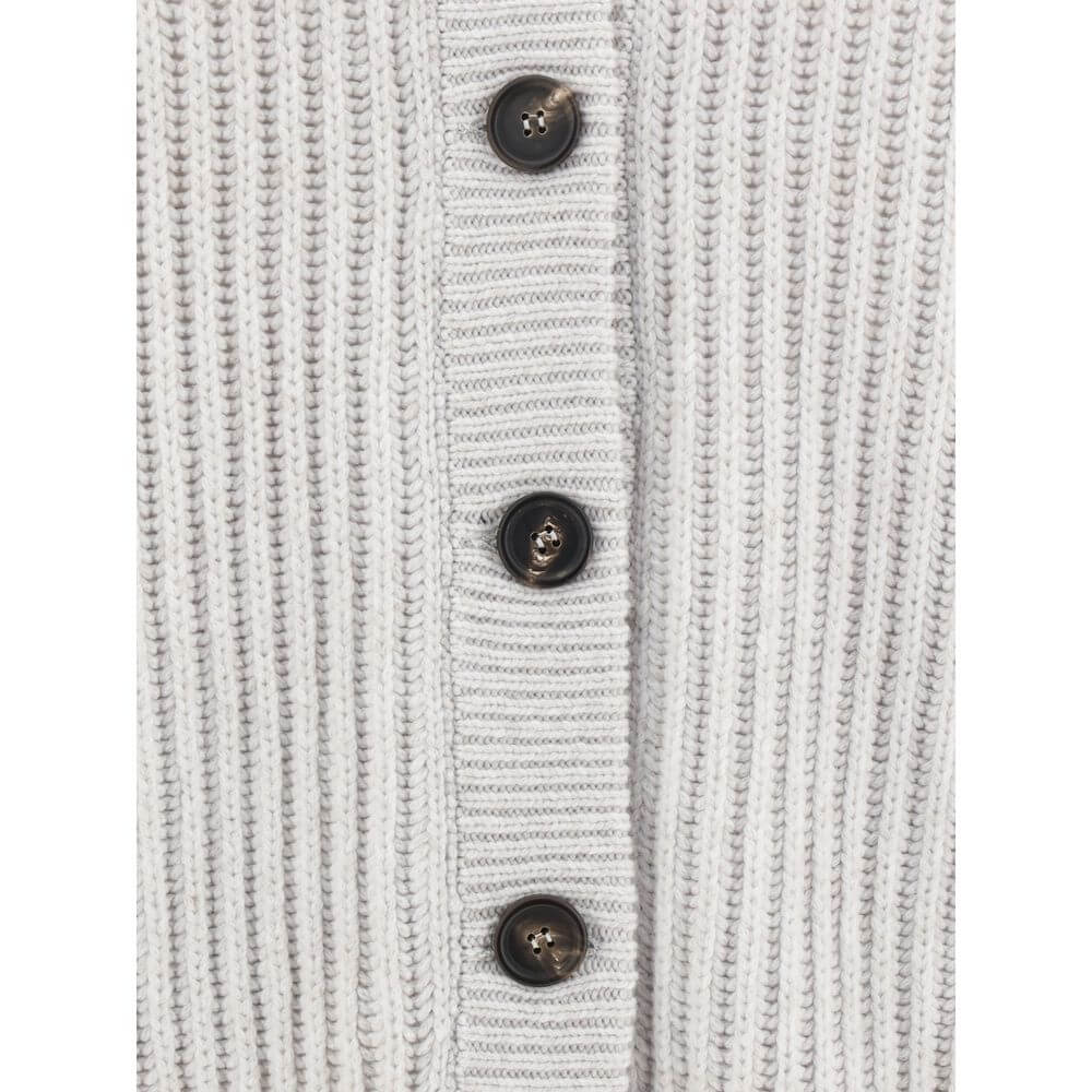 Close-up of Brunello Cucinelli White Cashmere Cardigan showing ribbed texture and contrasting buttons for elegance and comfort.